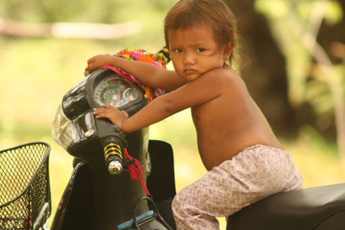 kid_on_moto.JPG